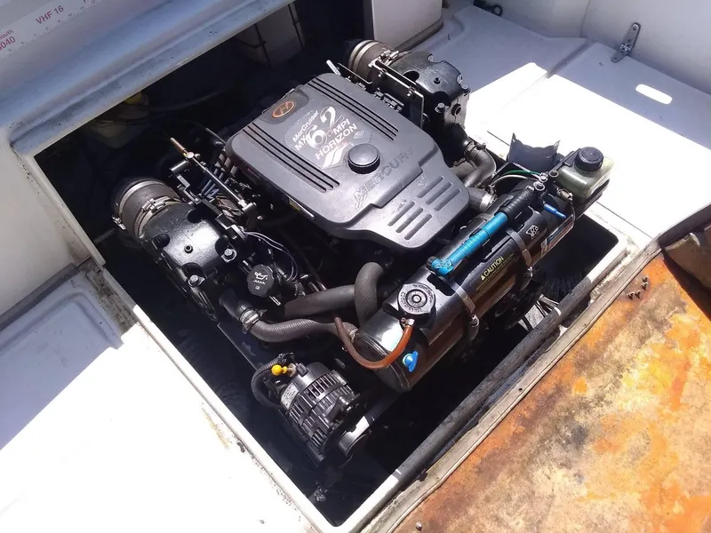 Slide: The Image of Engine compartment of a 1987 Hinterhoeller Limestone Express boat, showcasing detailed mechanics. - 10