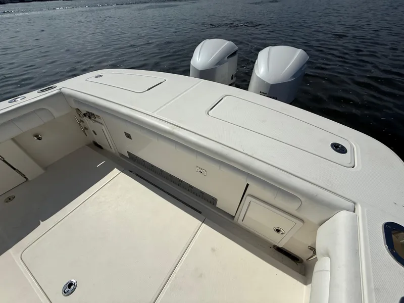 Slide: The Image of 2018 Regulator 31 boat deck with twin outboard engines on water. - 11