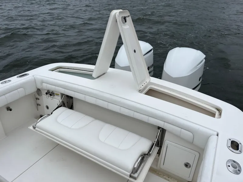 Slide: The Image of 2018 Regulator 31 boat with white seating and dual Yamaha outboard engines. - 13