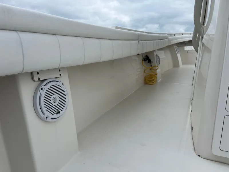 Slide: The Image of 2018 Regulator 31 boat interior with speakers and coiled yellow hose. - 25