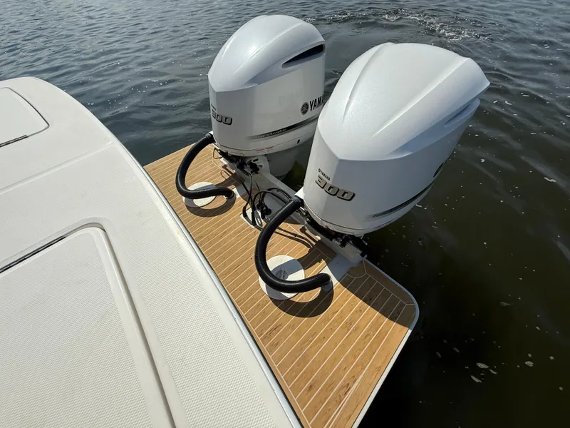 Slide: The Image of 2018 Regulator 31 boat with twin Yamaha 300 engines on teak deck. - 8