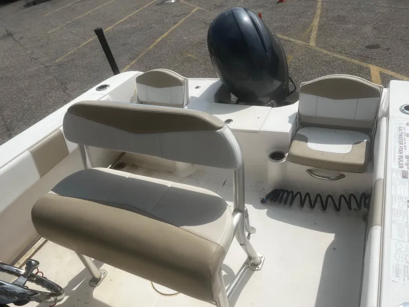 Slide: The Image of 2018 Robalo R200 Center Console boat interior with seating and motor. - 11