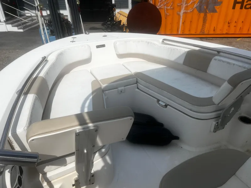 Slide: The Image of 2018 Robalo R200 Center Console boat interior with cushioned seating. - 13