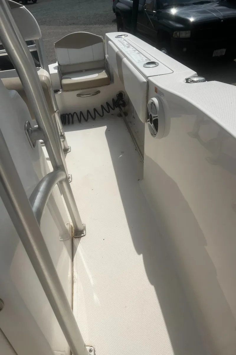 Slide: The Image of 2018 Robalo R200 Center Console boat interior with seating and storage. - 14