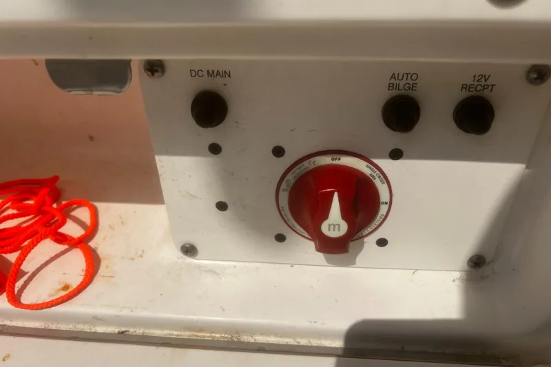 Slide: The Image of 2018 Robalo R200 Center Console control panel with red switch and wiring. - 18