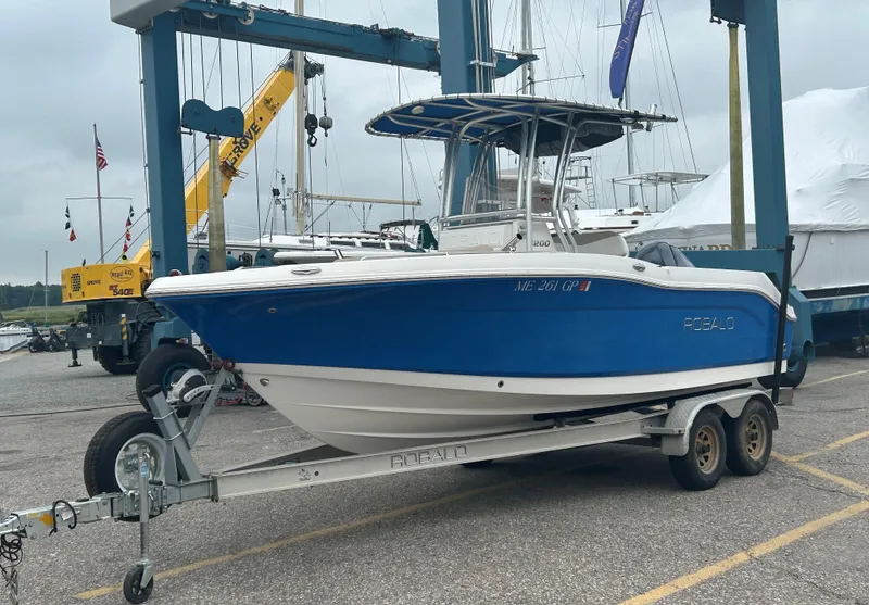 Slide: The Image of 2018 Robalo R200 Center Console boat on trailer at marina. - 2