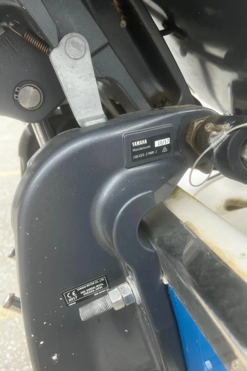 Slide: The Image of Close-up of a Yamaha motor part on a 2018 Robalo R200 Center Console boat. - 21