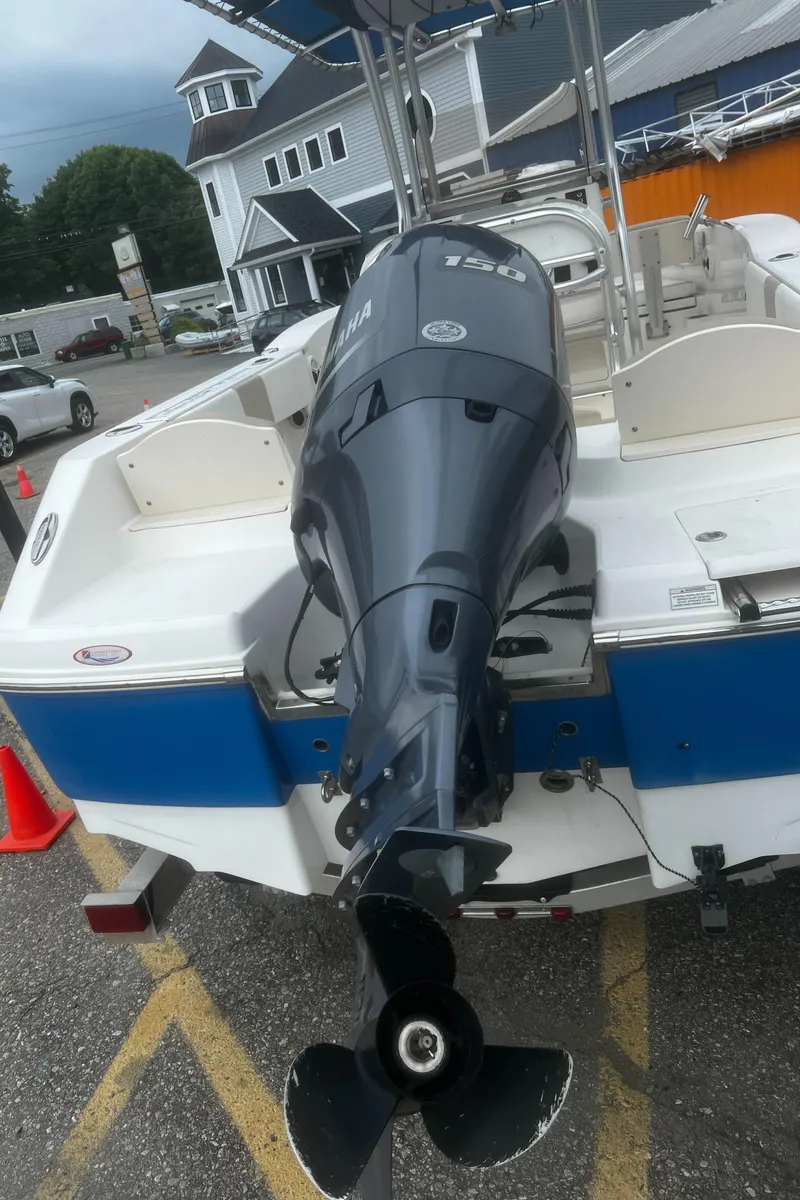 Slide: The Image of 2018 Robalo R200 Center Console boat with Yamaha outboard motor, parked outdoors. - 24