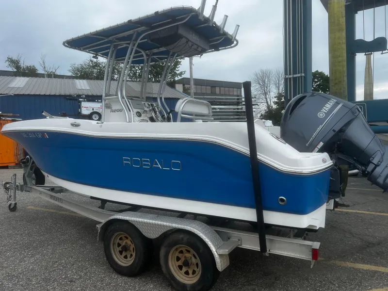 Slide: The Image of 2018 Robalo R200 Center Console boat on trailer with Yamaha outboard motor. - 3