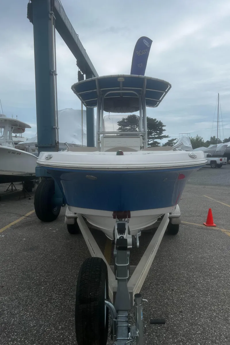 Slide: The Image of 2018 Robalo R200 Center Console boat on trailer in marina setting. - 7