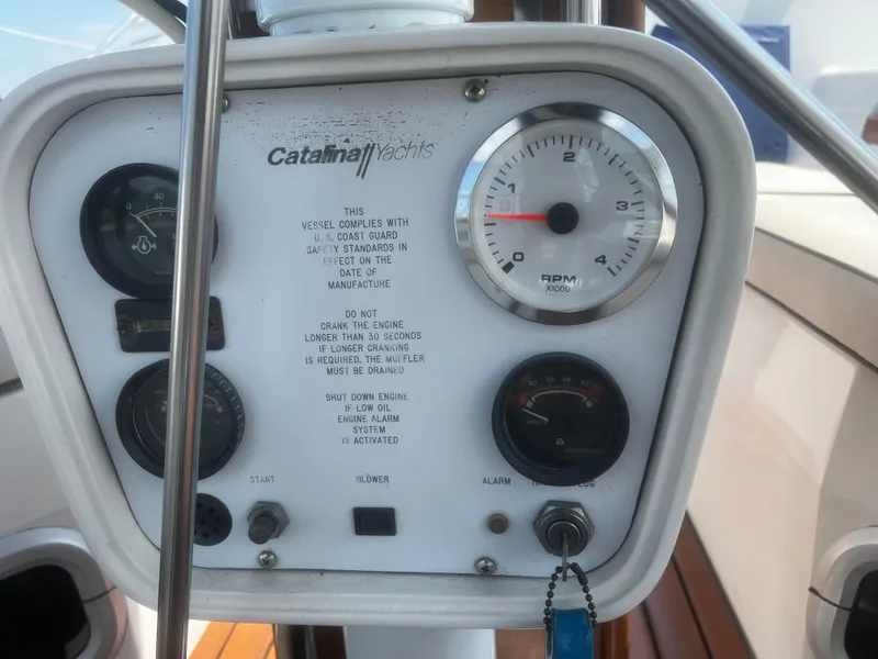 Slide: The Image of Control panel of a 1990 Catalina 42 yacht with gauges and RPM meter. - 15