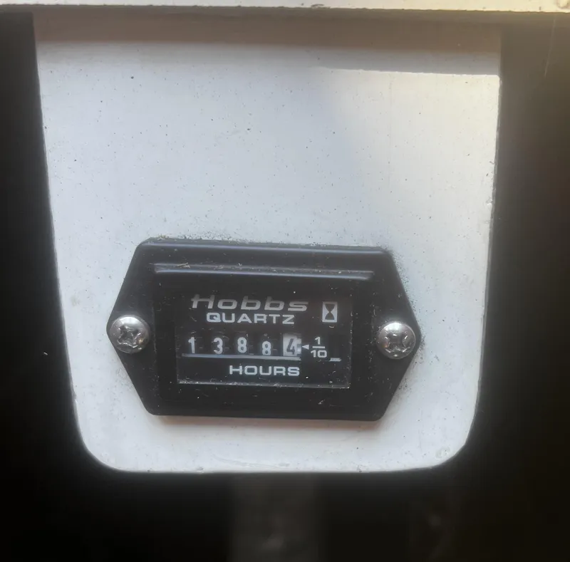 Slide: The Image of Hobbs Quartz hour meter showing 1388.4 hours on a 1990 Catalina 42. - 20