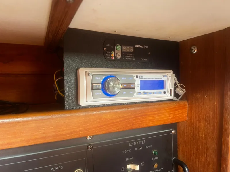 Slide: The Image of Stereo system and control panel inside a 1990 Catalina 42 sailboat cabin. - 26