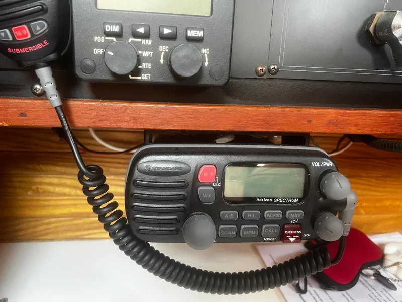 Slide: The Image of Marine radio equipment on a 1990 Catalina 42 sailboat, featuring a Horizon Spectrum model. - 27