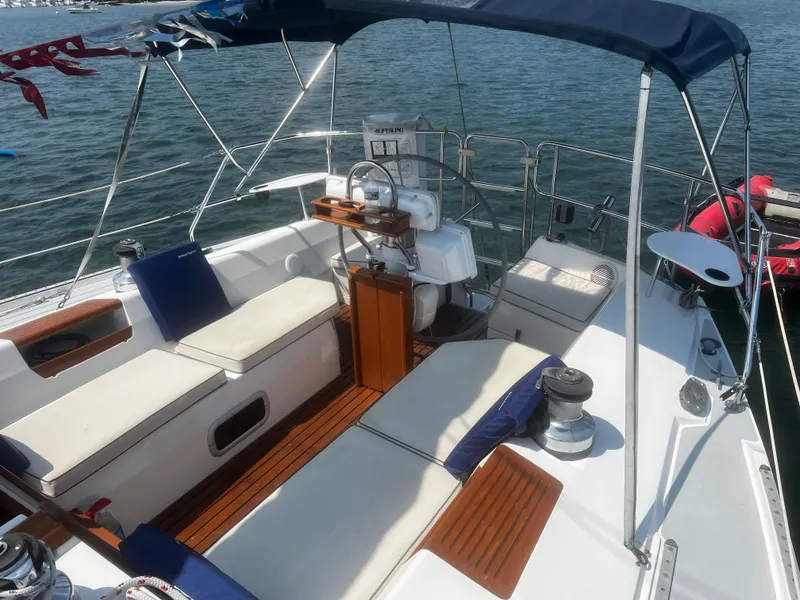 Slide: The Image of Cockpit of a 1990 Catalina 42 sailboat with seating and steering wheel. - 3