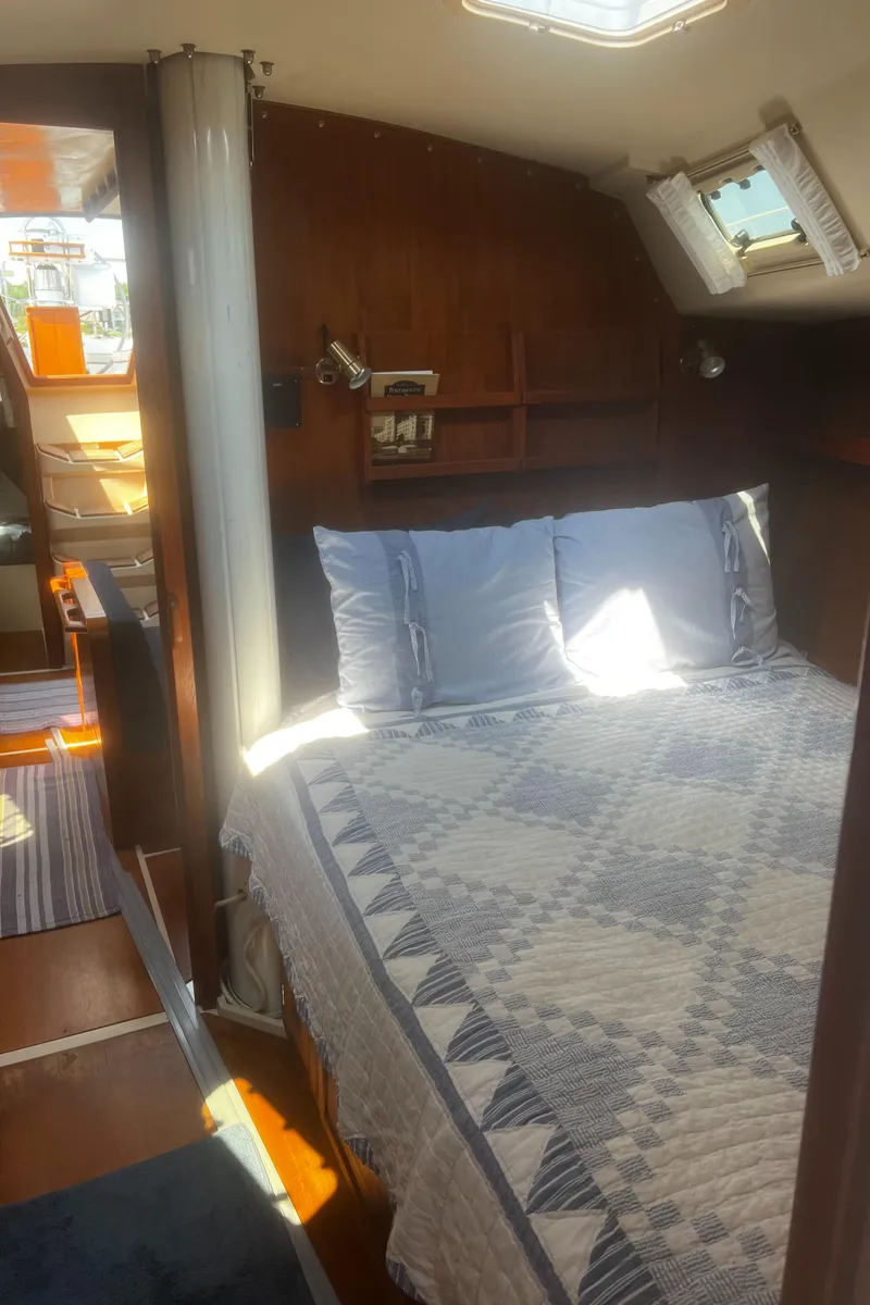 Slide: The Image of Cozy interior of 1990 Catalina 42 sailboat with bed and natural light. - 30