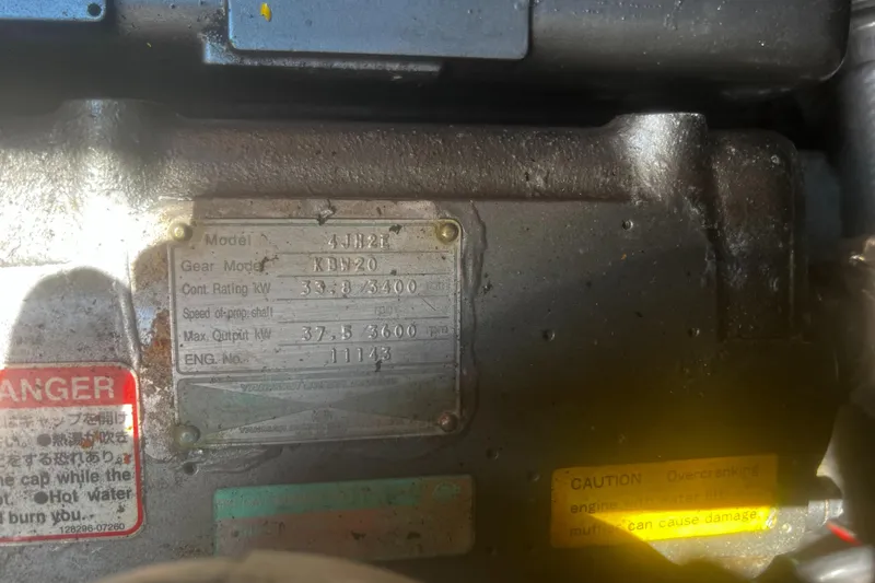 Slide: The Image of Close-up of a Catalina 42 engine plate, displaying model and specifications. - 39