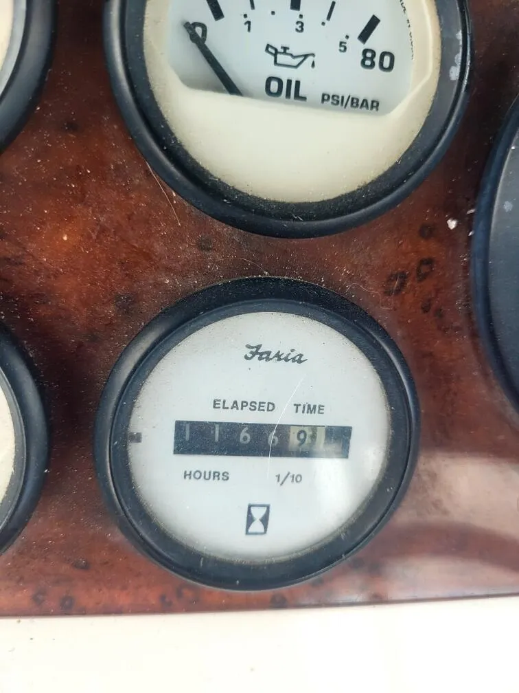 Slide: The Image of Close-up of 1999 Silverton 37 Convertible boat's Faria elapsed time gauge. - 15