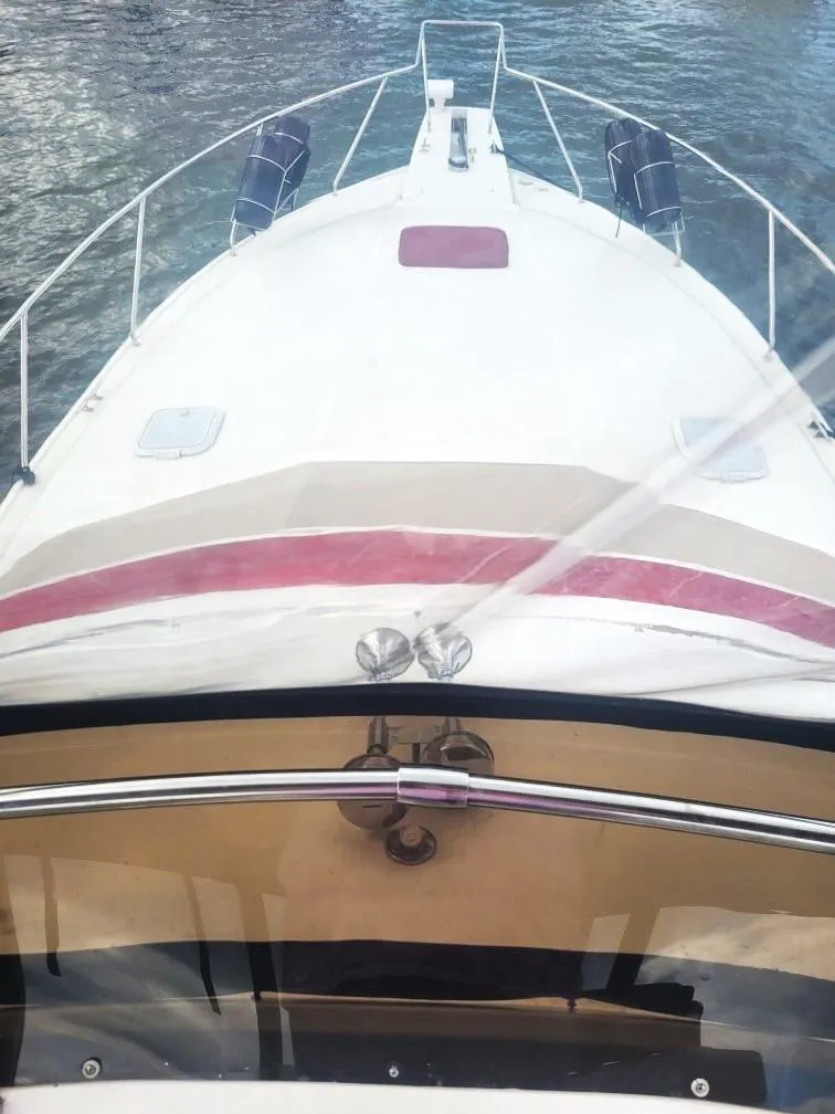 Slide: The Image of 1999 Silverton 37 Convertible yacht on water, view from helm. - 5
