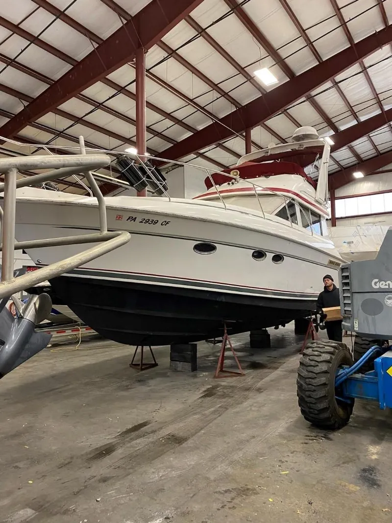 Slide: The Image of 1999 Silverton 37 Convertible boat in indoor storage facility. - 7
