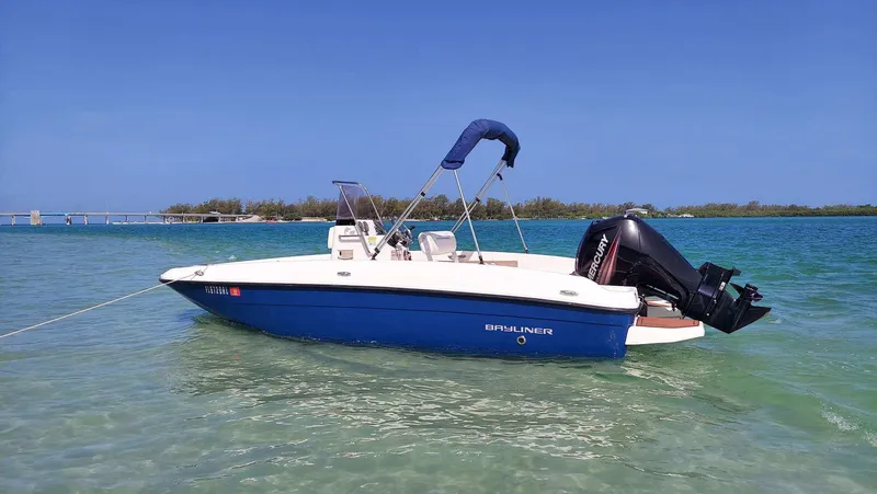 Slide: The Image of 2017 Bayliner Element F18 boat in clear blue water. - 0