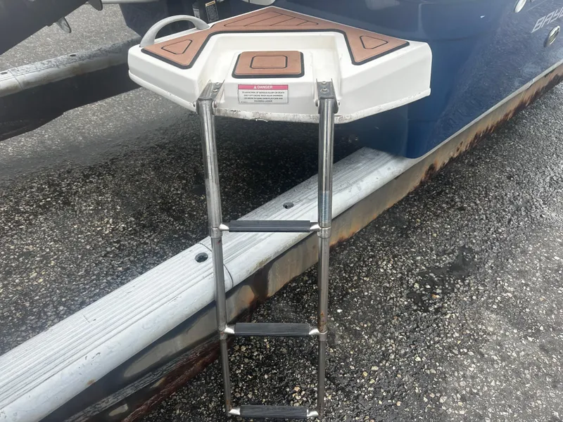 Slide: The Image of Bayliner Element F18 2017 boat ladder on trailer, close-up view. - 12