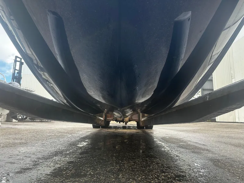 Slide: The Image of Underside view of 2017 Bayliner Element F18 boat on a wet surface. - 8
