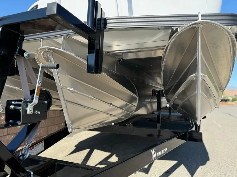 Slide: The Image of 2025 Manitou Explore 24 Switchback Dual SHP pontoon boat with trifold bench, underside view. - 7