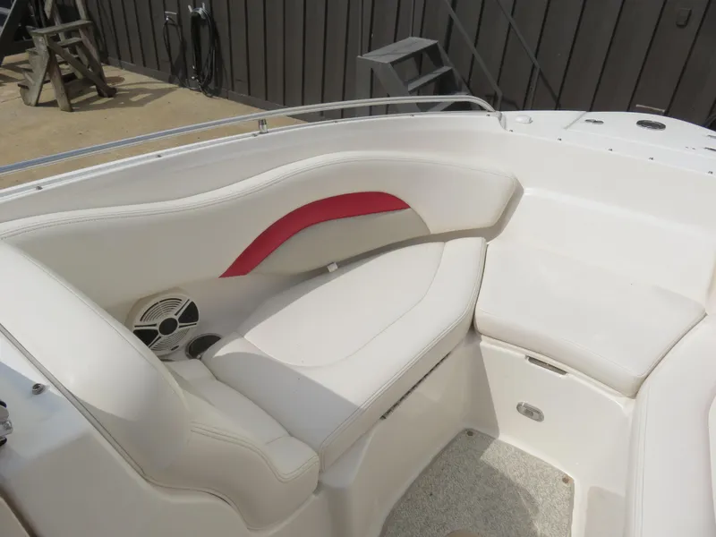 Slide: The Image of 2008 Chaparral SSX 236 boat interior with white seating and red accent. - 10