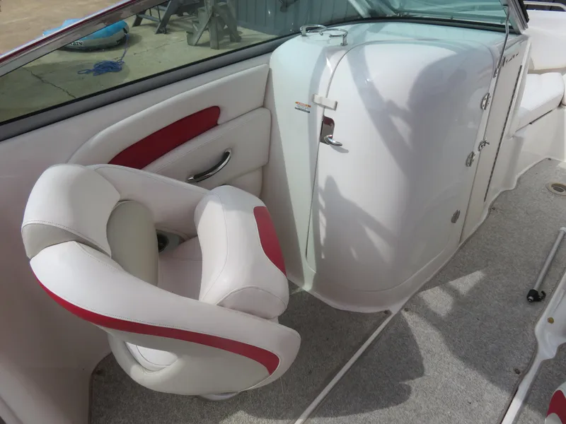 Slide: The Image of 2008 Chaparral SSX 236 boat interior with white and red seating. - 7