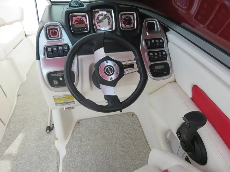 Slide: The Image of Interior dashboard of 2008 Chaparral SSX 236 boat with steering wheel and controls. - 9