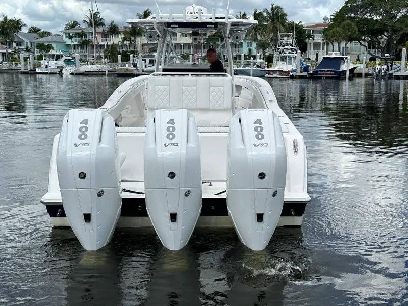 Slide: The Image of 2013 Invincible 42 Open Fisherman with triple 400 V10 engines on a calm marina. - 11