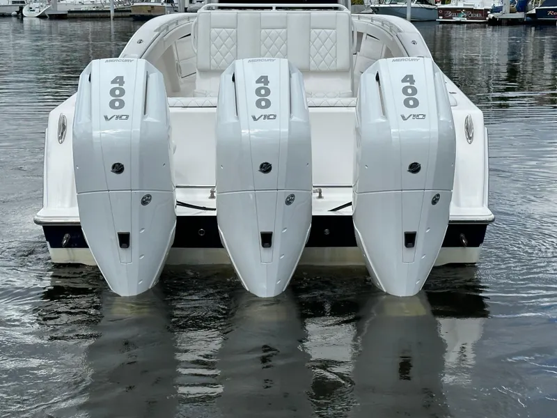 Slide: The Image of 2013 Invincible 42 Open Fisherman with four 400 V10 engines on water. - 12