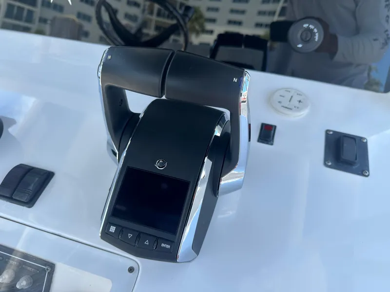 Slide: The Image of Close-up of 2013 Invincible 42 Open Fisherman boat throttle controls. - 20