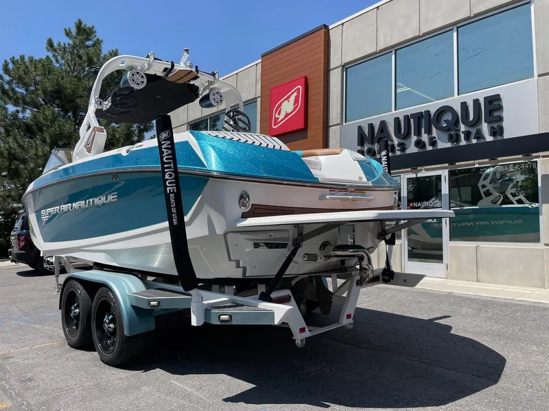 Slide: The Image of 2017 Nautique Super Air G23 boat on trailer outside dealership. - 3