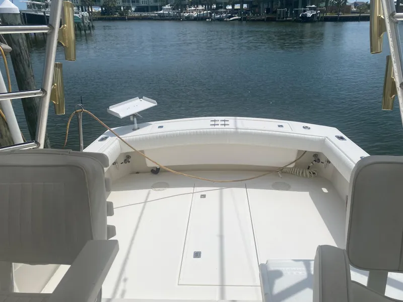 Slide: The Image of 2000 Albemarle 280 Express Fisherman boat deck overlooking calm marina waters. - 14