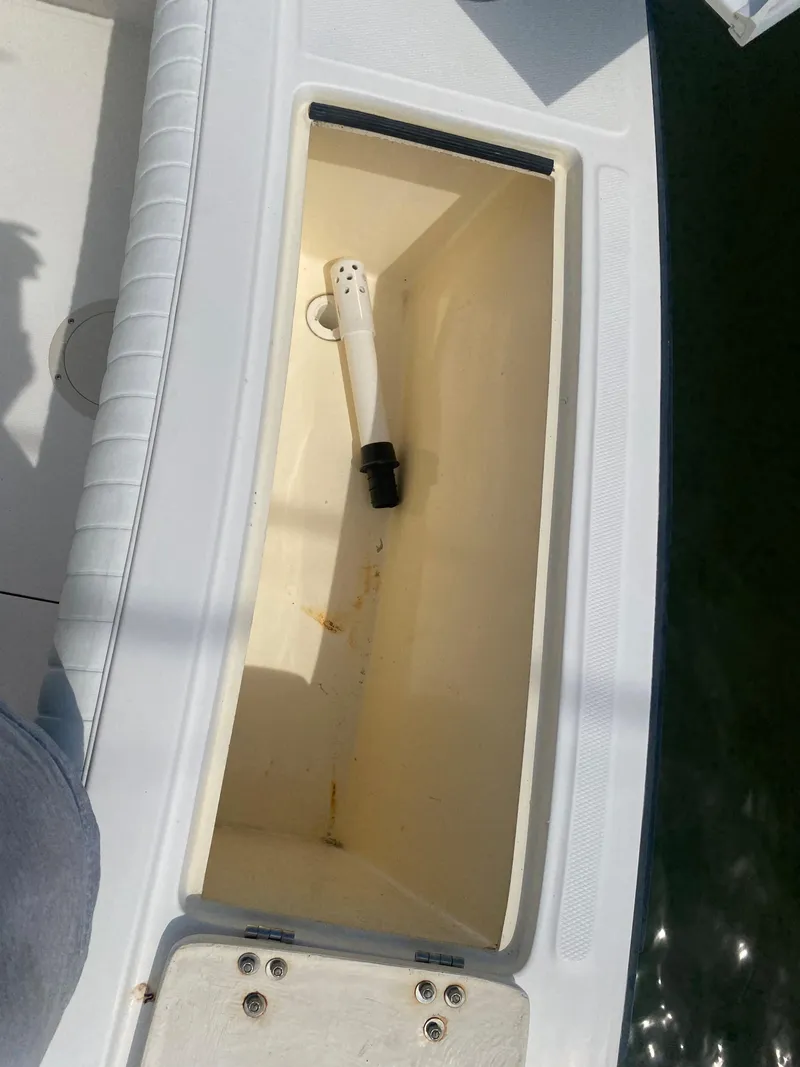 Slide: The Image of Open storage compartment on 2000 Albemarle 280 Express Fisherman boat. - 19
