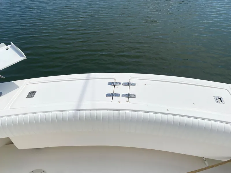 Slide: The Image of Albemarle 280 Express Fisherman 2000 boat deck with white seating, on calm water. - 20