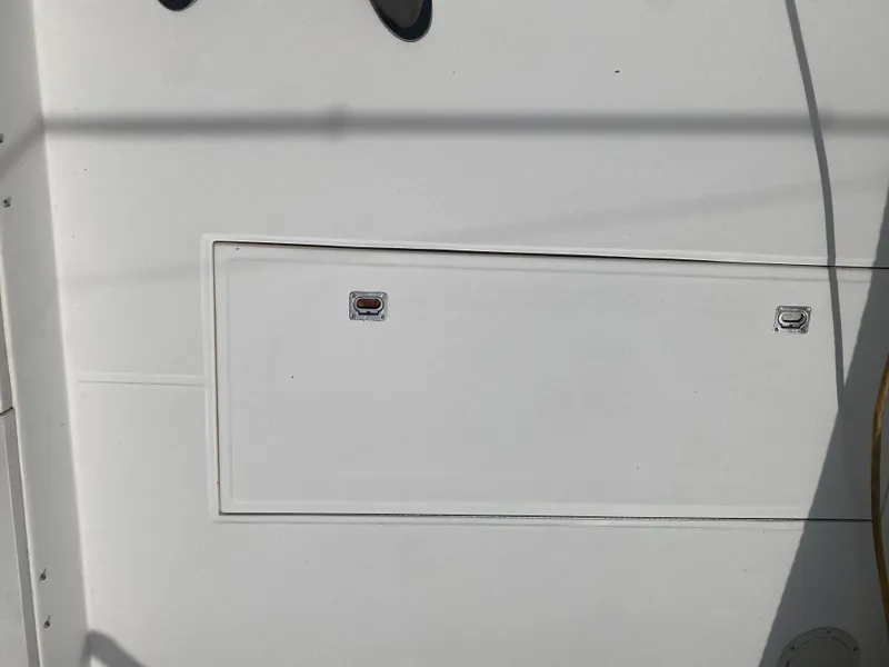 Slide: The Image of Albemarle 280 Express Fisherman 2000 boat deck with storage compartment. - 21