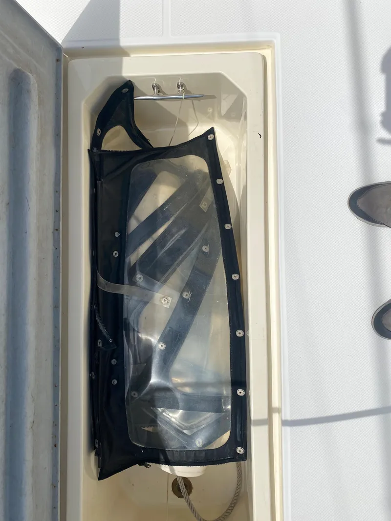 Slide: The Image of Albemarle 280 Express Fisherman 2000 boat storage compartment with clear cover. - 22