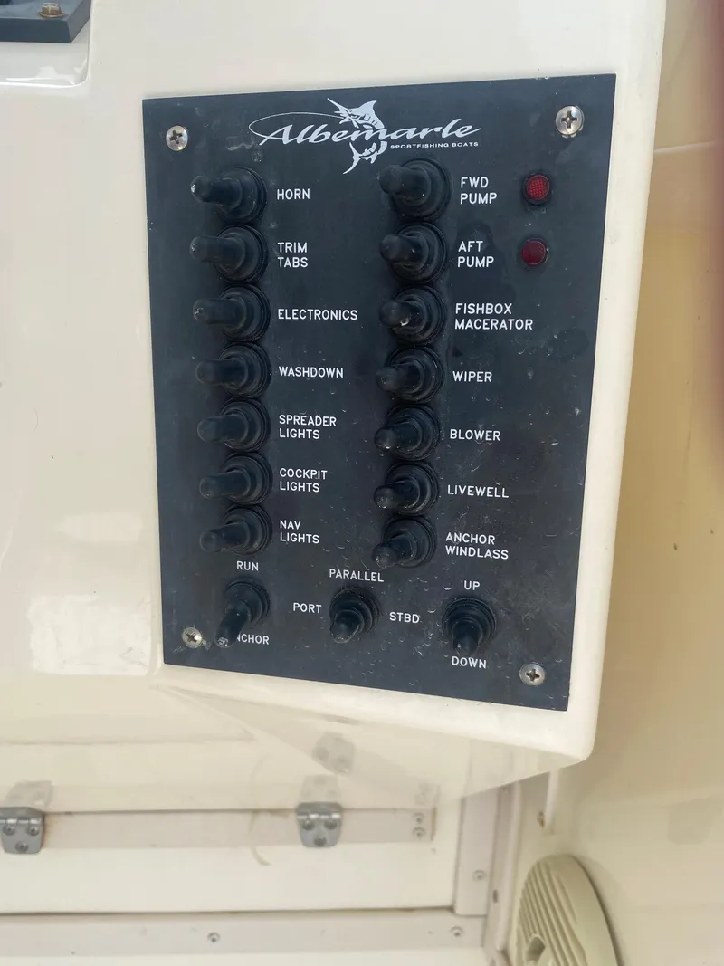 Slide: The Image of Control panel of a 2000 Albemarle 280 Express Fisherman boat with labeled switches. - 23