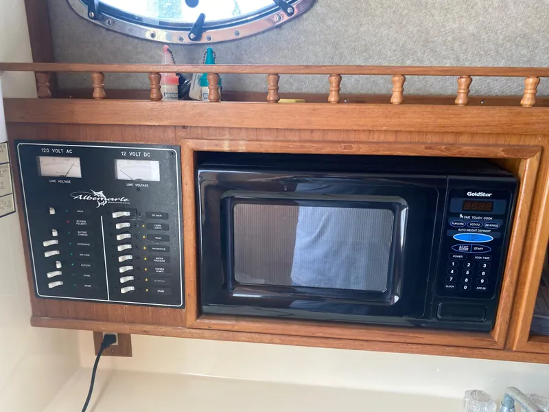 Slide: The Image of 2000 Albemarle 280 Express Fisherman interior with control panel and microwave. - 31
