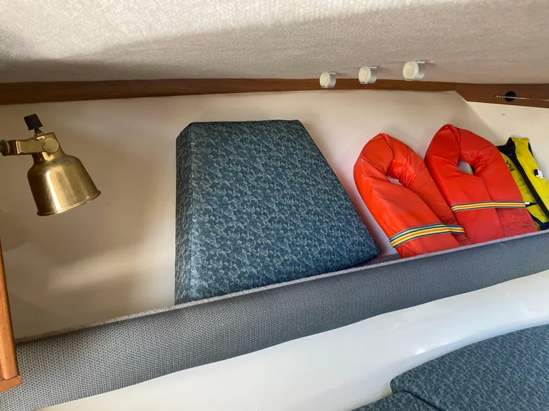 Slide: The Image of Interior of 2000 Albemarle 280 Express Fisherman with life jackets and cushions. - 34
