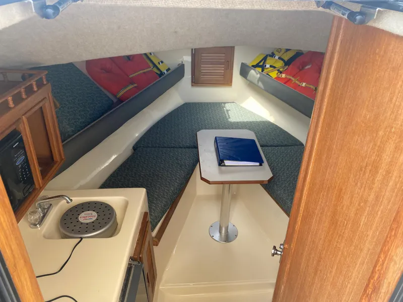 Slide: The Image of Interior of 2000 Albemarle 280 Express Fisherman boat with seating and kitchenette. - 35