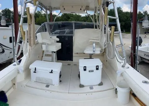 Slide: The Image of 2000 Albemarle 280 Express Fisherman boat interior with seating and coolers. - 42