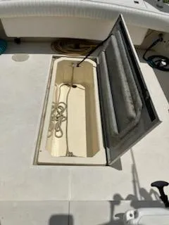 Slide: The Image of Open storage compartment on 2000 Albemarle 280 Express Fisherman boat deck. - 45