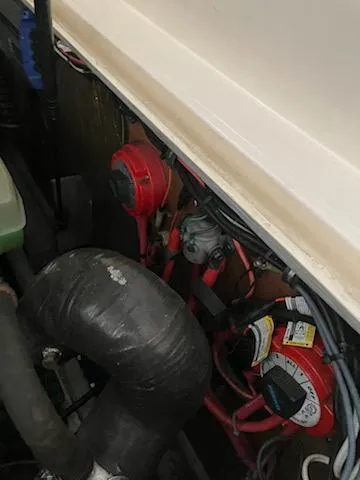 Slide: The Image of Engine compartment of 2000 Albemarle 280 Express Fisherman boat, showing wiring and components. - 47