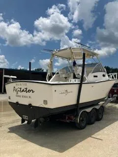 Slide: The Image of 2000 Albemarle 280 Express Fisherman boat on trailer under a cloudy sky. - 5