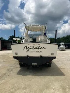 Slide: The Image of 2000 Albemarle 280 Express Fisherman boat, rear view, parked outdoors under cloudy sky. - 6