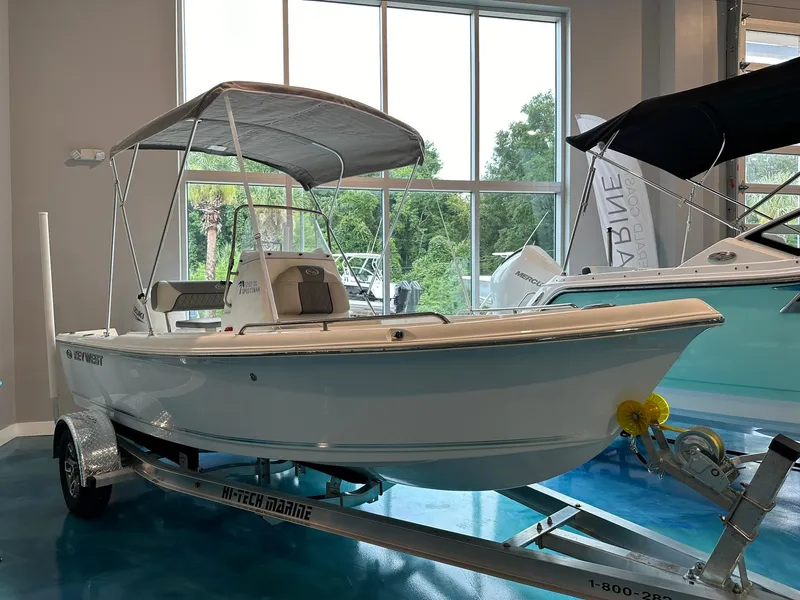 The Image of 2025 Key West 1720 Center Console boat displayed indoors on a trailer. - 0